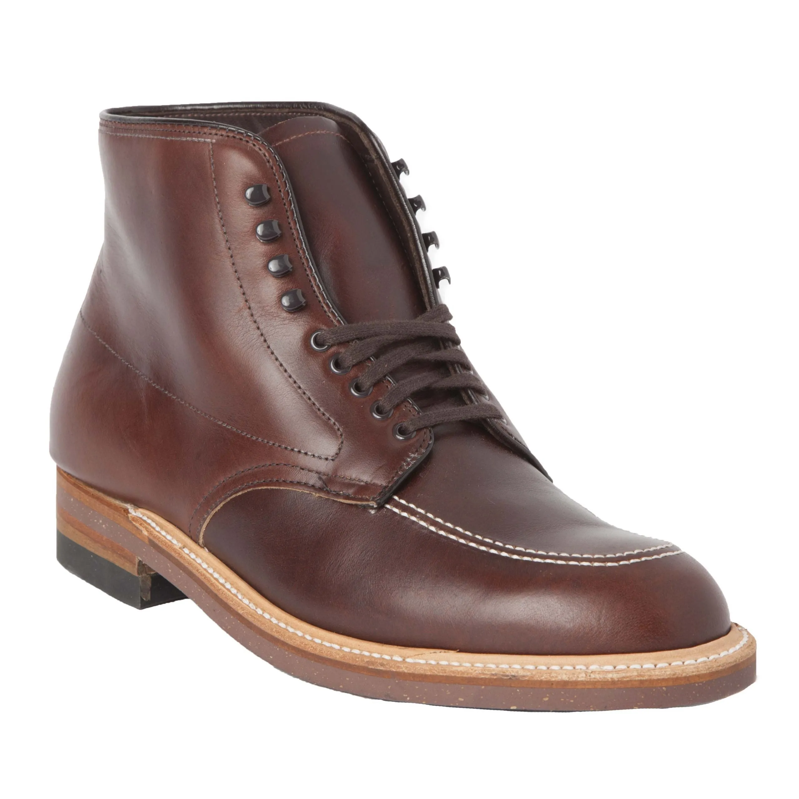 The Alden Madison 403 - Indy Boot in Brown Chromexcel is a single leather boot with a round toe and lace-up design featuring speed hooks for quick fastening. It has a contrasting tan cork sole, black heel, visible stitching, and a slight sheen for a polish