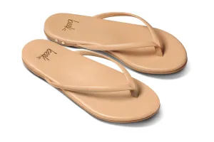 Sunbeam leather flip flop sandal in beach - angle shot