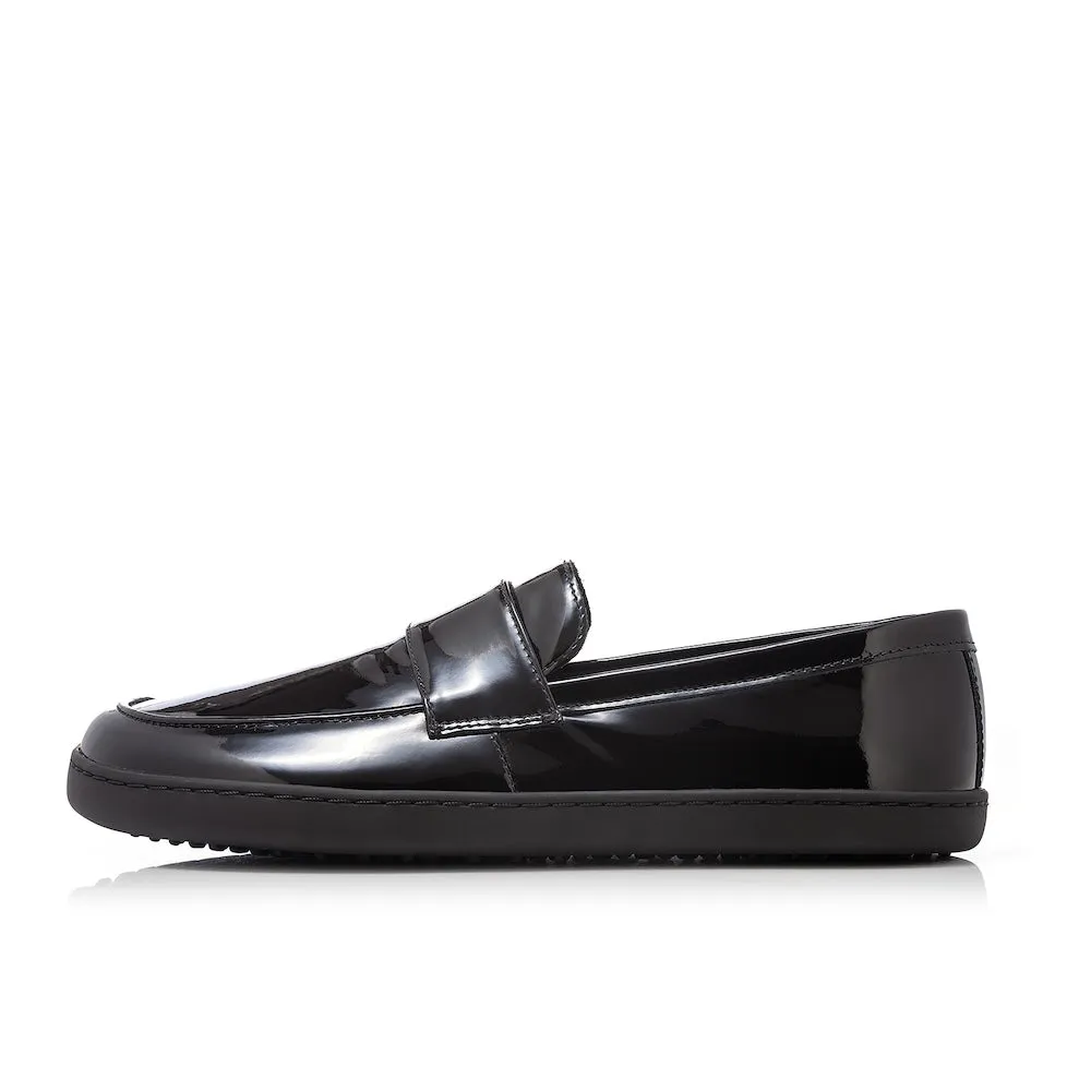 Black patent leather Shapen Sheen loafers. Shoes are a classic loafer design with a sheen with black rubber soles glued and sewn on. Left shoe is shown facing left against a white background. #color_black