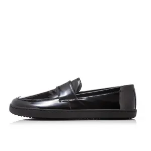 Black patent leather Shapen Sheen loafers. Shoes are a classic loafer design with a sheen with black rubber soles glued and sewn on. Left shoe is shown facing left against a white background. #color_black